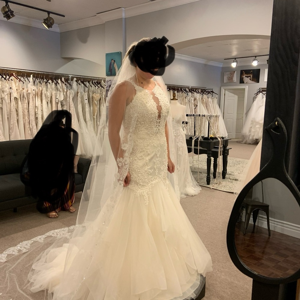 Maggie Sottero Veda white wedding dress.